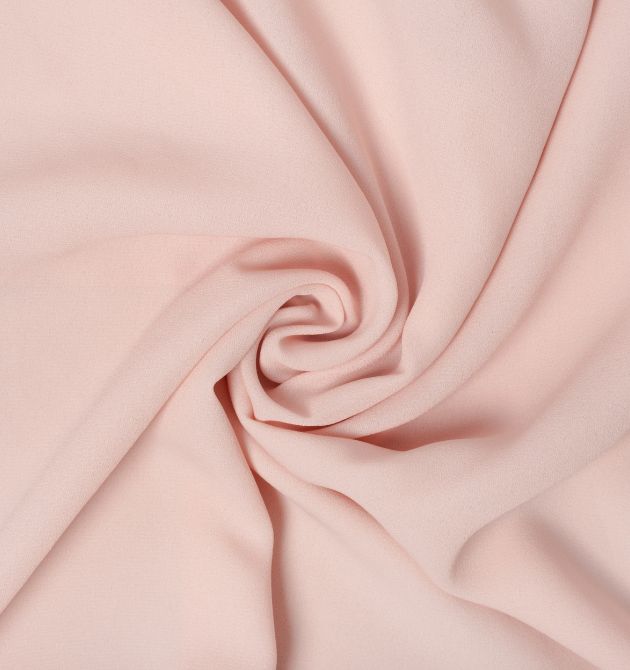 Here is the image of the light pink color cloth which is the material example of viscose material which is made using the best yarn weaving machine in India