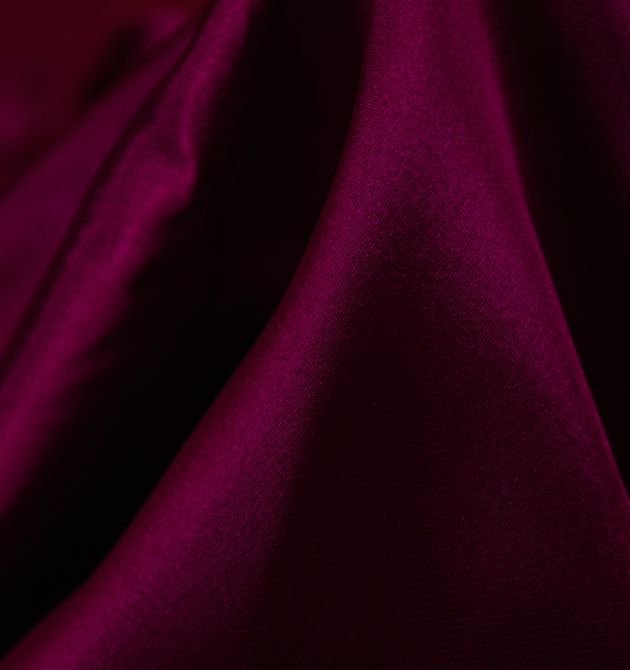 Here is the image of the Dark purple color cloth which is the material example of Silk material which is made using the best yarn weaving machine in India